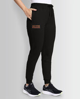 Model wearing Dcyphr's women Decode Essentials Joggers (Black)